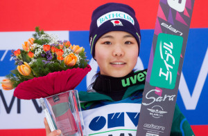 Sara Takanashi of Japan celebrates after after winning the women's ski jumping World Cup in Ljubno, Slovenia, Sunday, Feb. 17, 2013. (AP Photo/Vid Ponikvar)